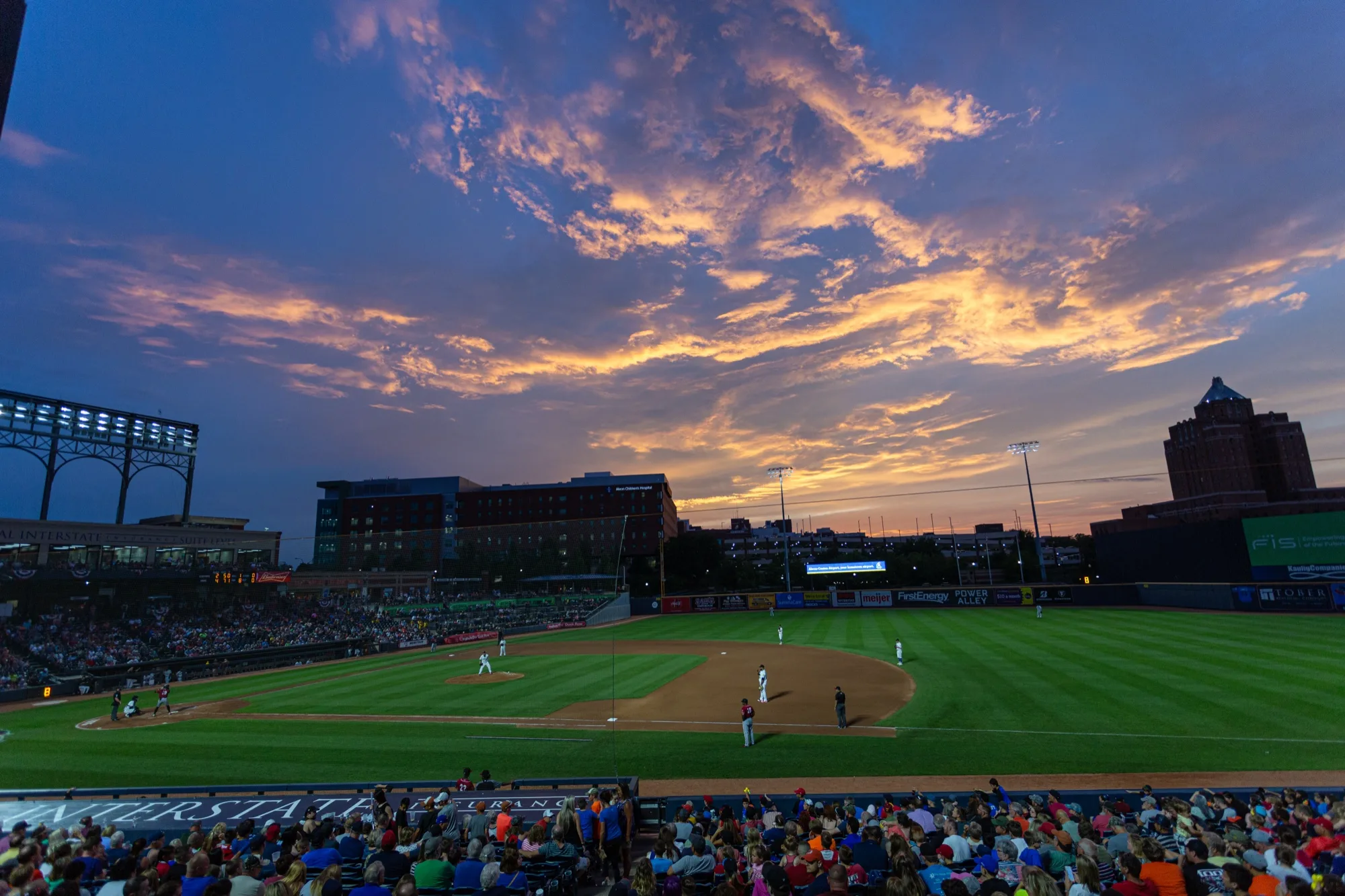 A RubberDucks baseball game at 7 17 Credit Union Park beneath an Akron sunset