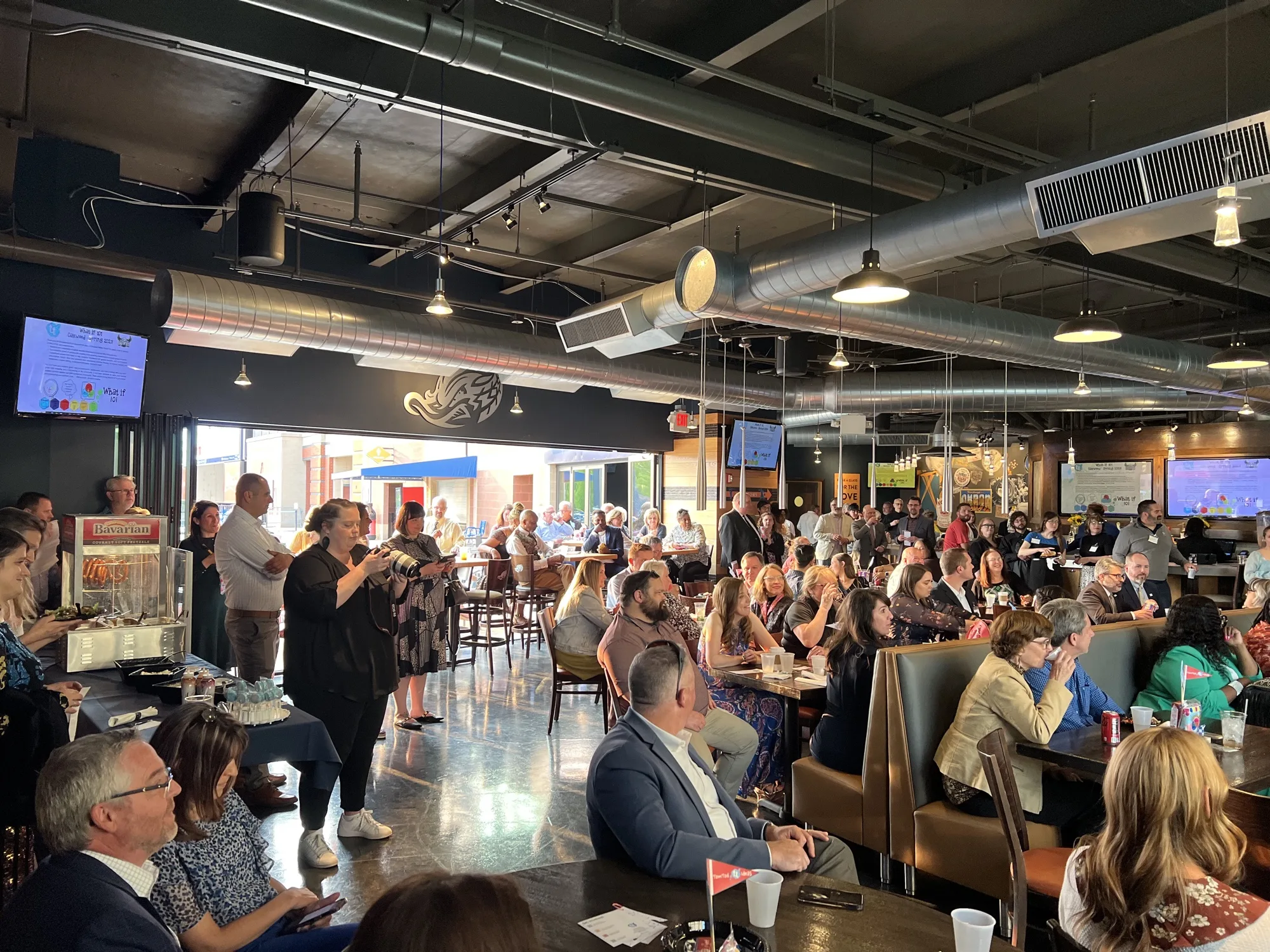 Guests gathering for a reception inside the Kaulig Companies Championship Club