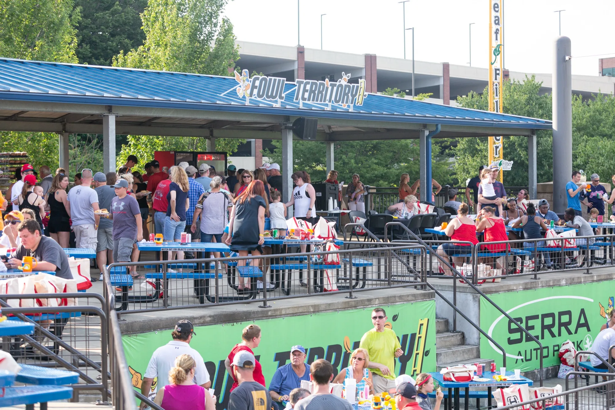 Guests enjoying a picnic-style gathering in Serra Auto Park Fowl Territory