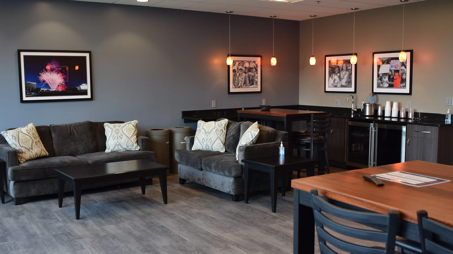 Renovated Owner’s Suite with lounge seating, dining tables and a service counter